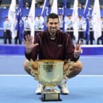 Novak Djokovic wins 102nd title as De Minaur retires injured