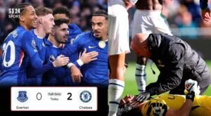 Pedro Neto celebrates scoring for Chelsea against Everton as goalkeeper Emiliano Martinez suffers a head injury during the Premier League match.