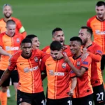 Shakhtar Donetsk players celebrate their 3-1 comeback victory against AEK Athens at Stamford Bridge in the Champions League