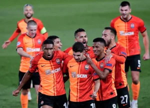 Shakhtar Donetsk players celebrate their 3-1 comeback victory against AEK Athens at Stamford Bridge in the Champions League