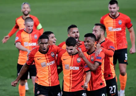 Shakhtar Donetsk players celebrate their 3-1 comeback victory against AEK Athens at Stamford Bridge in the Champions League