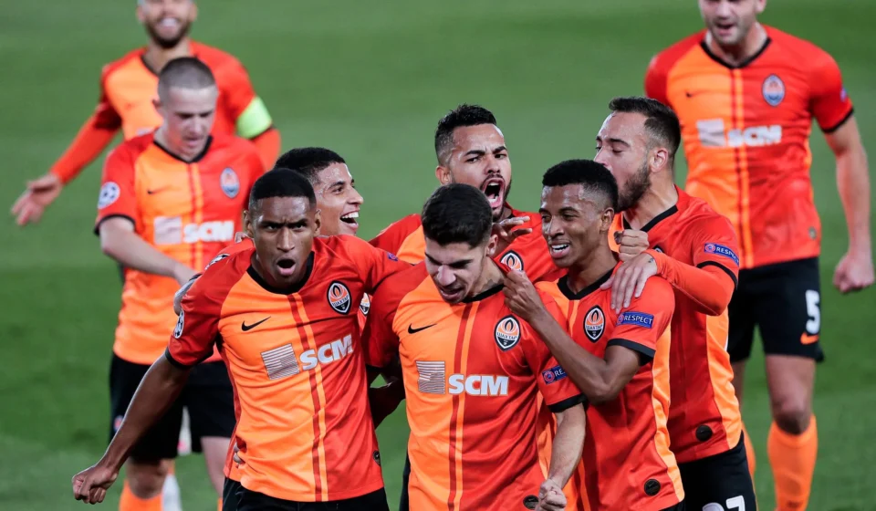 Shakhtar Donetsk players celebrate their 3-1 comeback victory against AEK Athens at Stamford Bridge in the Champions League